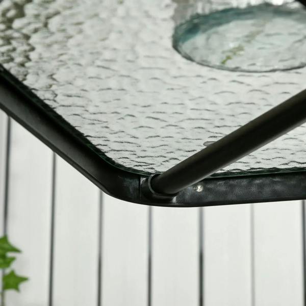 Close-up of black frame corner on tempered glass top outdoor dining table