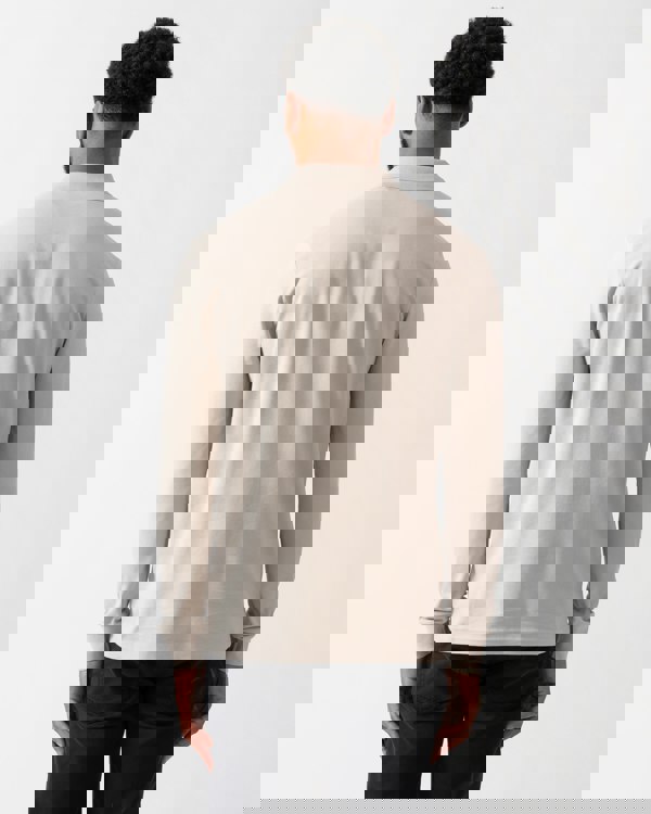 back shot of a model wearing a BOSS Orange Passerby Mens Long Sleeve Stretch-Cotton Polo Shirt with Logo Patch in Open Grey