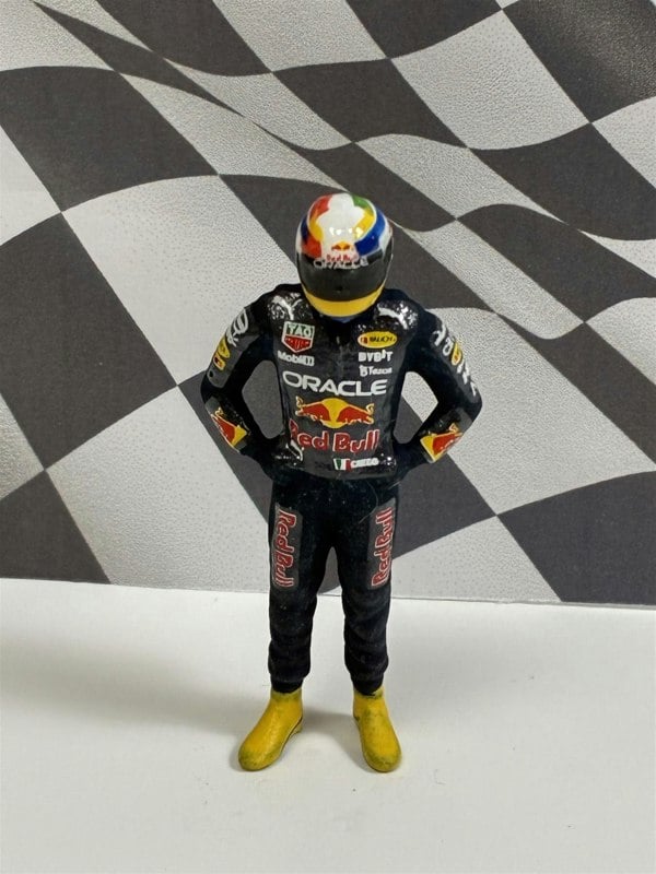 a toy figure of a man wearing a helmet