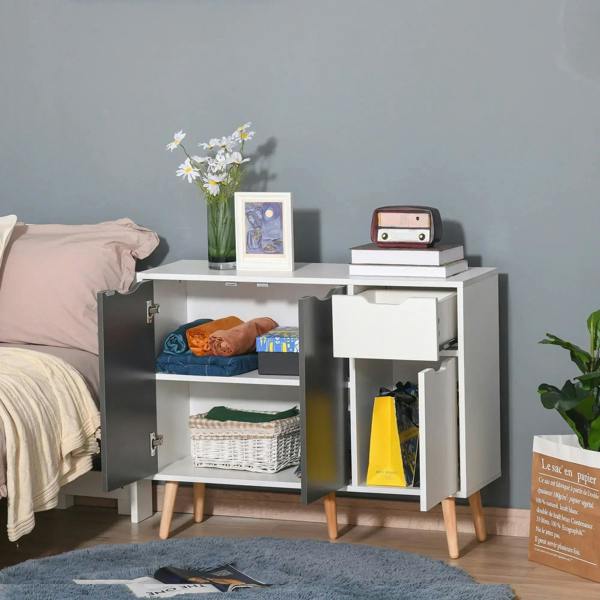 Grey and white sideboard with open shelves and drawers, showing interior storage