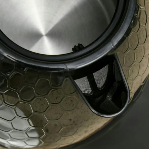 Black electric kettle spout area with visible filter mesh and outlet
