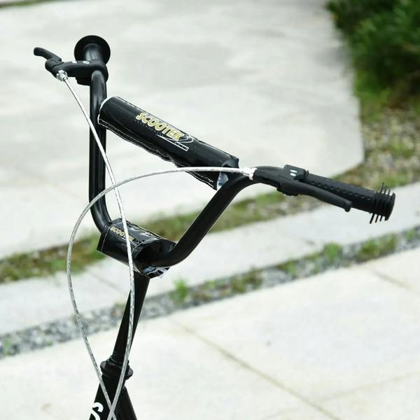 Black kids kick scooter close-up of adjustable handlebar and textured grips