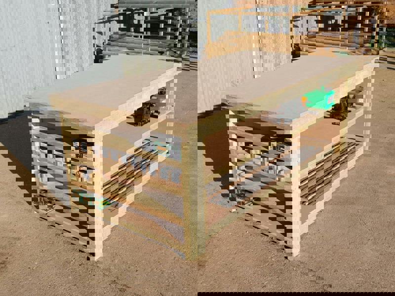 Wooden MDF top workbench with extra shelving and double shelf configuration, featuring a solid timber frame and smooth MDF work surface designed for practical workshop use