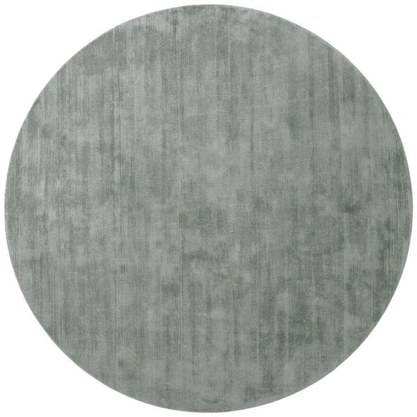 Round gray rug on a white background