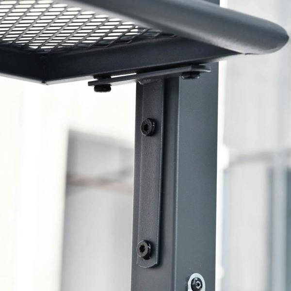 Grey metal gazebo frame corner joint with bolts under the double-tier roof