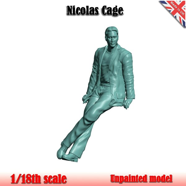 a statue of a man sitting on a white background