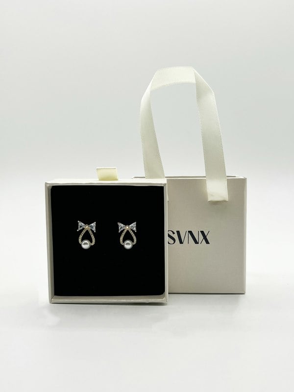 SVNX Studded Bow Earrings with Hanging Pearl in Gold Colour