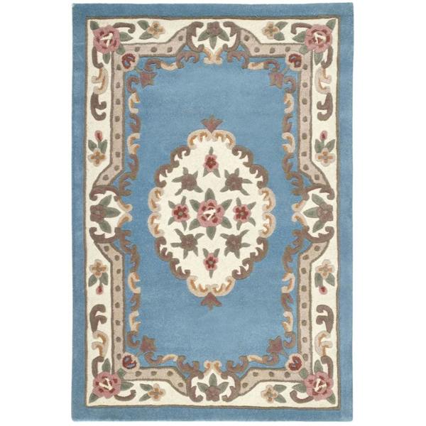 Decorative rug with floral pattern on a blue background