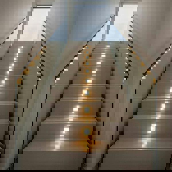 light for stair steps install in the middle of a modern staircase