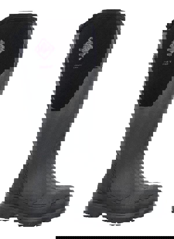 Muck Boots MUCK Chore XF Adjustable Womens Classic Stable Farm Wellington Wellies, black rubber waterproof boot with adjustable shaft and rugged sole.