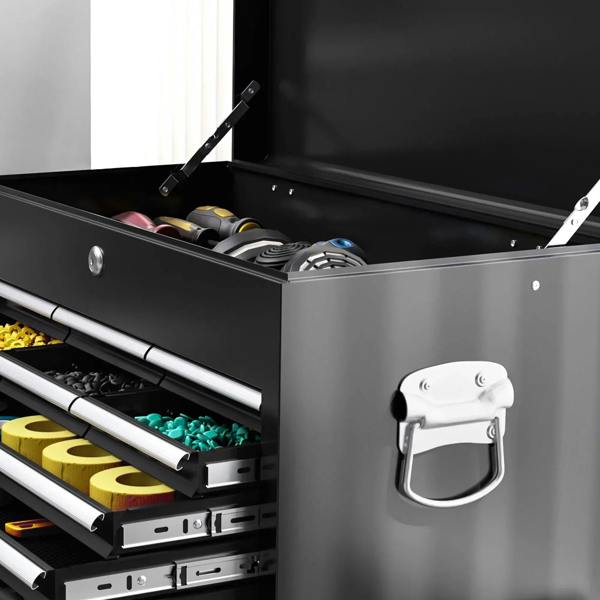 Black top compartment of tool chest with pull-open lid and two latches