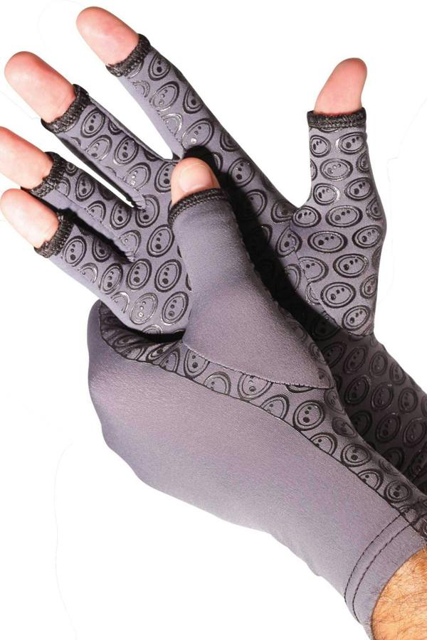Grey open-finger arthritis compression gloves with black circular grip print, worn on hands on white - Optimum