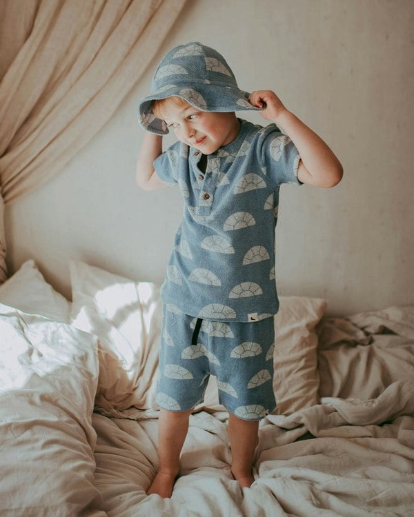 Boy wearing gender-neutral organic cotton kids shorts
