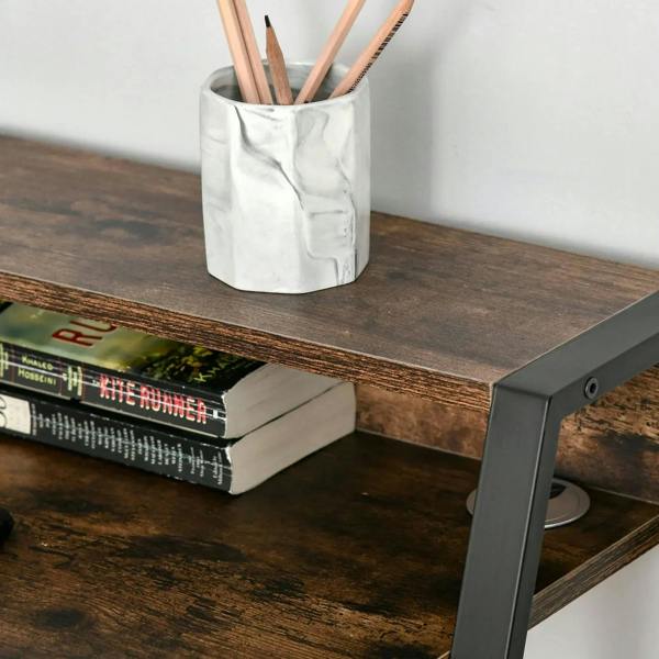 Rustic brown desktop corner with black frame and cable management port