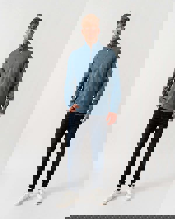 Model wearing HUGO Durty244 Mens 1/4 Zip Sweatshirt in Open Blue 496 - Full Length