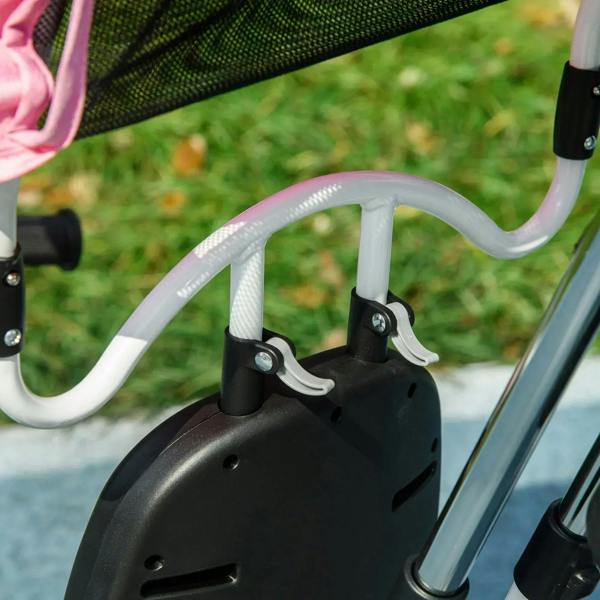 Front wheel and fork of pink kids trike with black fender
