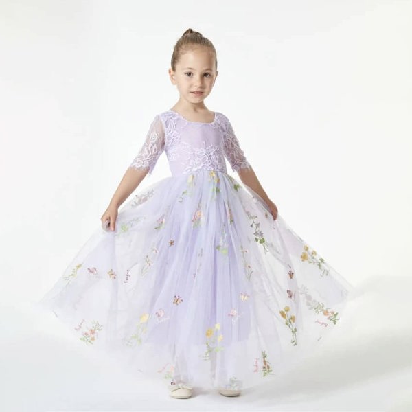 girl wearing a lilac embroidered dress 
