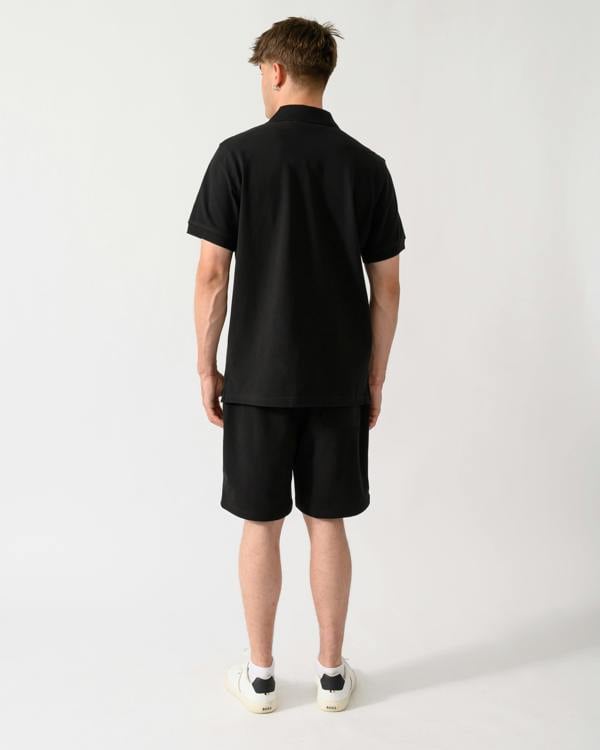 back shot of a model wearing a Belstaff Mens Logo Polo in Black