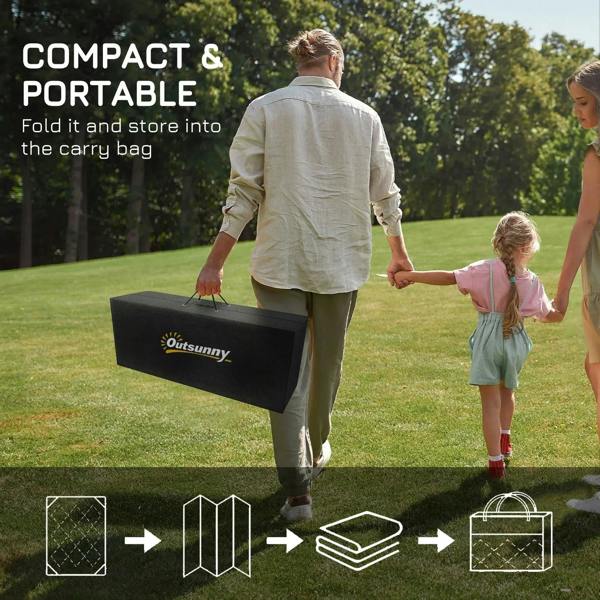 Reversible outdoor rug folded with a black carry bag and shown with ground stakes