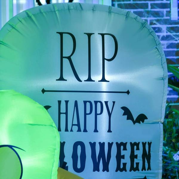 Green inflatable tombstone with RIP and Happy Halloween lettering and LED glow