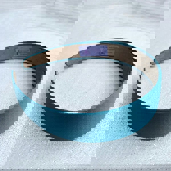 Teal hairband, smooth satin finish, slim padded design, vibrant teal colour, classic everyday accessory, elegant minimalist headband
