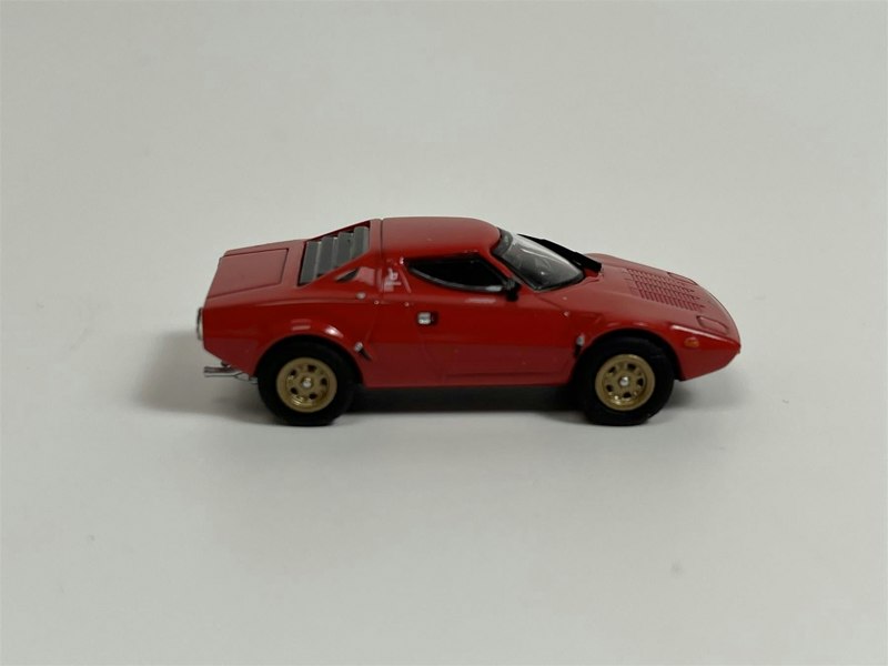 a red toy car on a white background