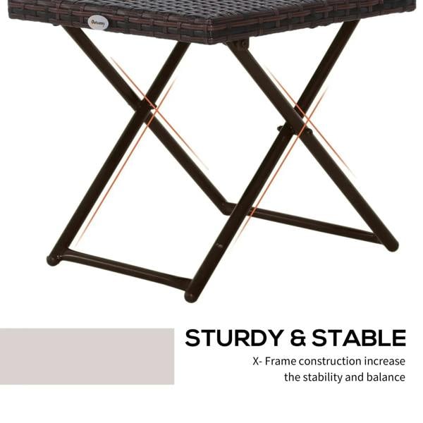 Brown folding rattan coffee table showing X-frame support under the top