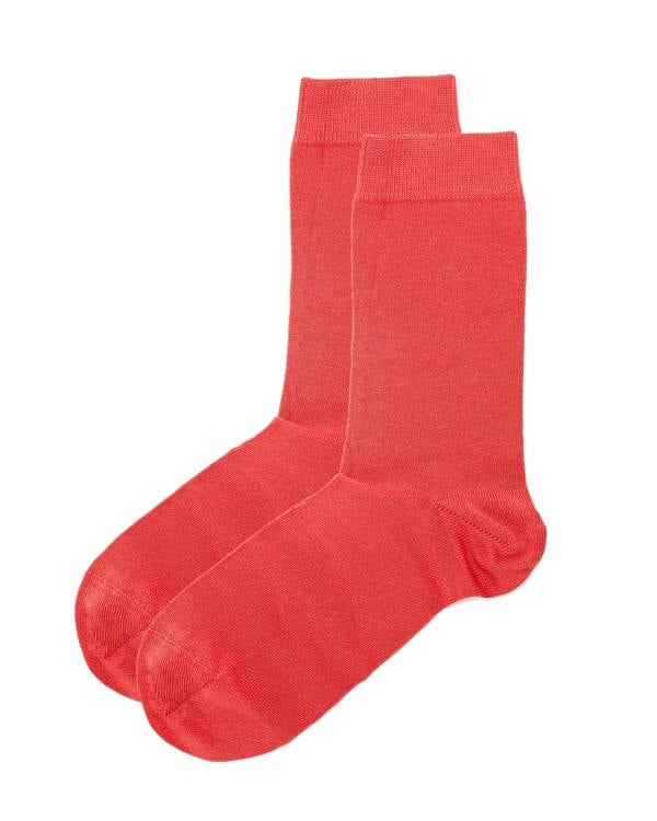 Pair of red dress socks on a white background