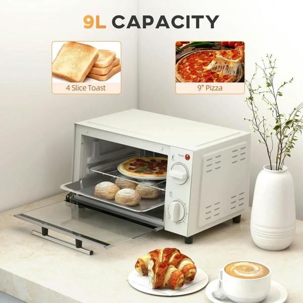 Cream countertop toaster oven with pizza and bread rolls inside, door open