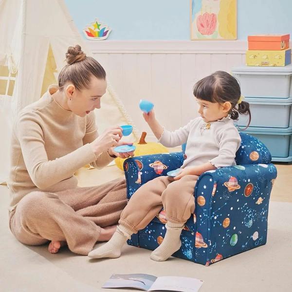 Blue space-themed kids armchair in use with child reading and playing