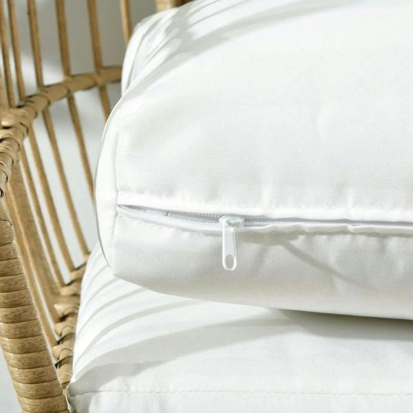 Close-up of white egg chair cushion with zipper closure and stitched seams