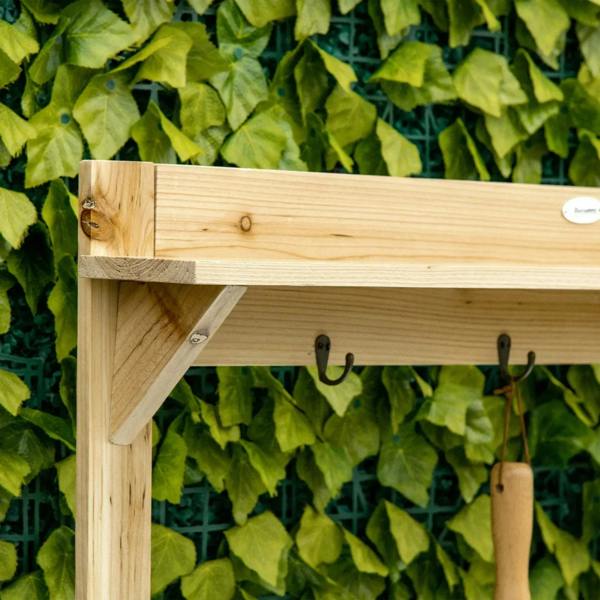 Natural wood potting bench top rail with four hanging hooks and sturdy side posts.