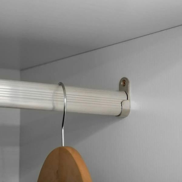 Chrome hanging rod bracket inside a white wardrobe