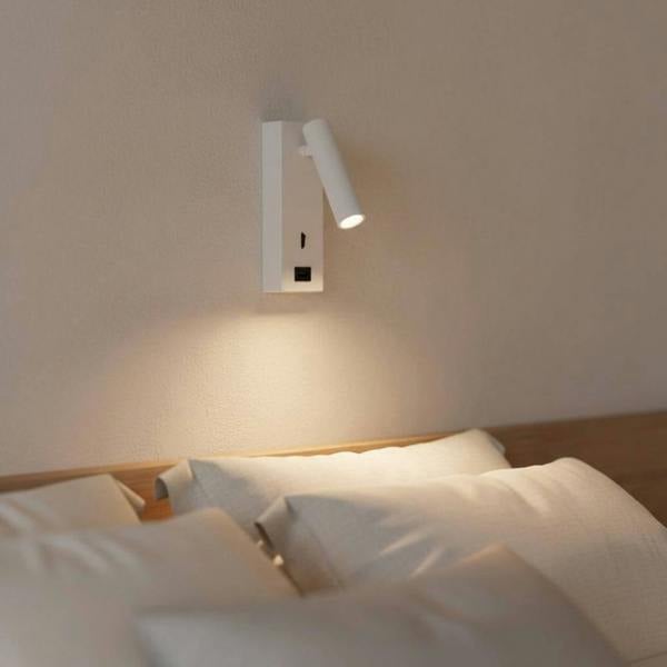 white wall mounted reading light with USB port mounted in a modern bedroom on the wall 