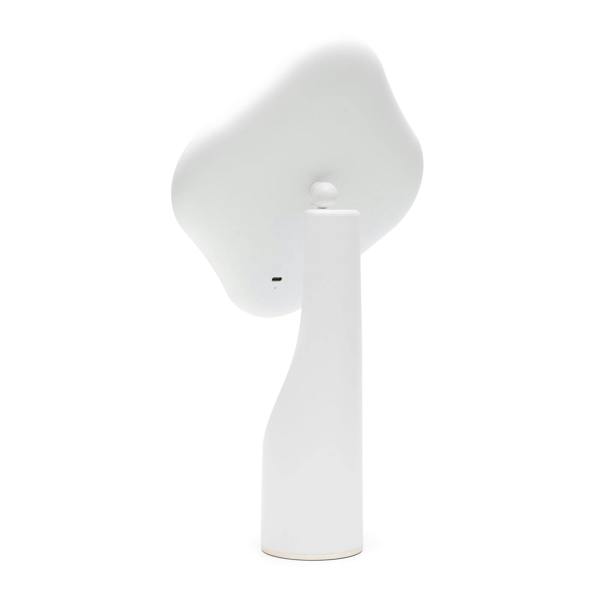The Rio Illuminated Full Size Beauty Mirror, with a modern minimalist white design and a tall, curved base, is shown from the back on a plain white background. Its flat, irregularly shaped head resembles a cordless beauty mirror.