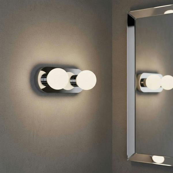 LED vanity wall light mounted next to a bathroom mirror 
