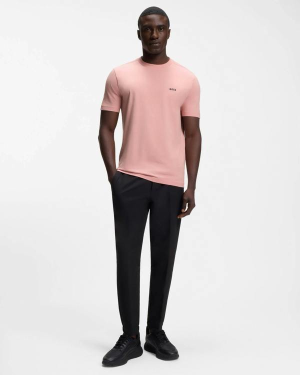 Model wearing BOSS Green Tee Mens Stretch Cotton T-Shirt with Contrast Logo in Light/Pastel Pink 686 - Full length