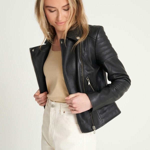 Image displays a model wearing the Barneys Originals victoria biker jacket. The jacket is unzipped and worn open to display how the lapels open and fold to the side.