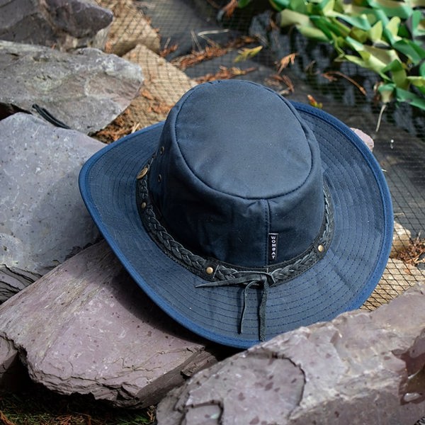 The wilderness navy waxed cotton unisex hat by Wombat