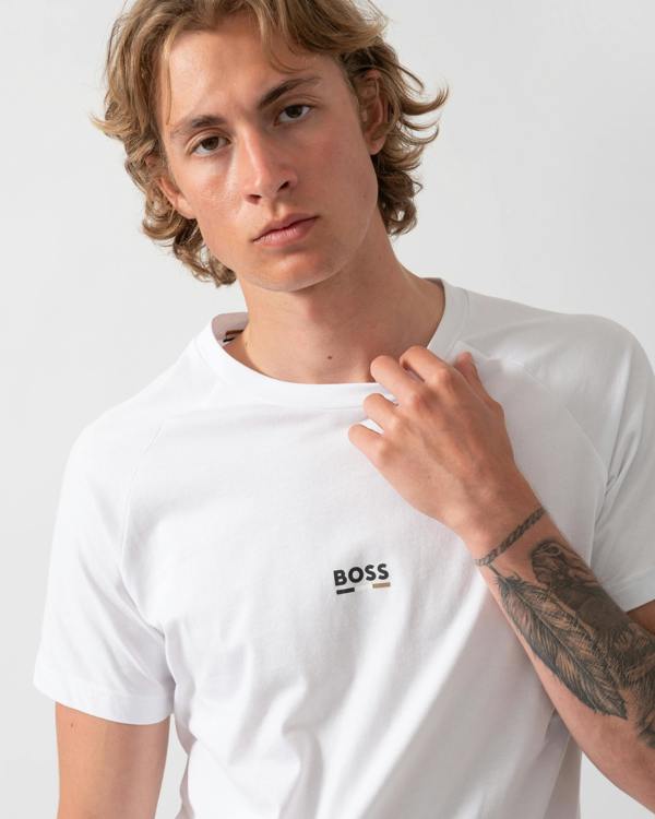 close up model wearing a BOSS Orange Mens Slim Fit Beach T-Shirt in Natural 105