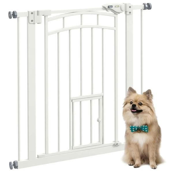 White pressure-fit stair gate with vertical bars and built-in small cat door.