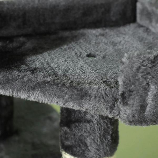 Grey plush scratching surface on a cat tree platform, textured fabric detail
