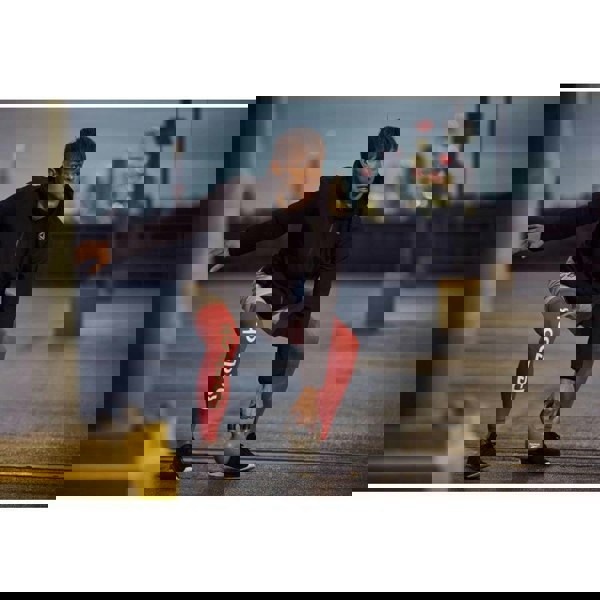 Man performing kettlebell workout outside using a Reebok 6kg Cast Iron Kettlebell