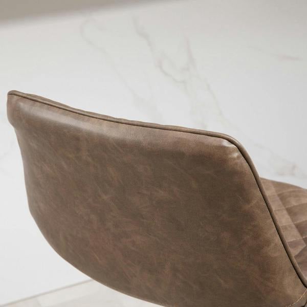 Brown bar stool side view with curved back and diamond-quilted PU upholstery