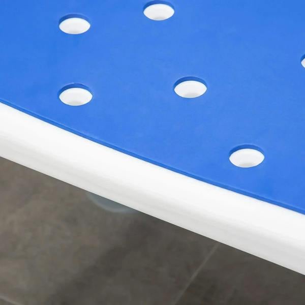 Close-up of blue padded shower chair seat with drainage holes