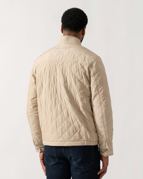 Model wearing GANT Mens Quilted Windcheater Jacket in 200 Oat Beige - back
