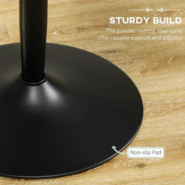 Black round base of pedestal table with non-slip pad detail underneath