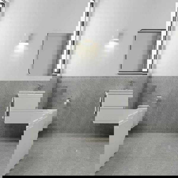 white vanity wall light fixture mounted on a modern bathroom walll next to the mirror 