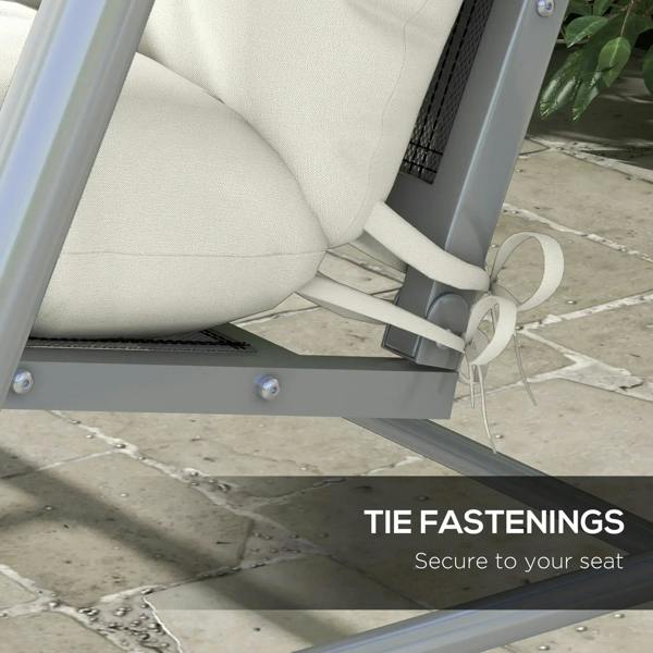 White patio cushion with tie straps secured at the seat edge for a snug fit