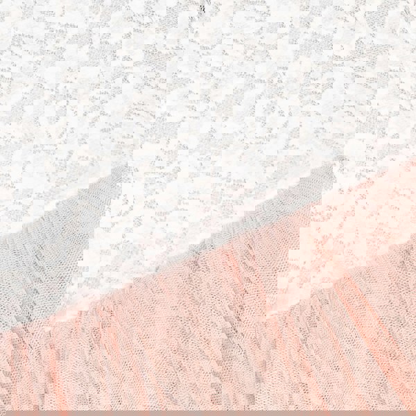 Close-up of blush fabric with a textured pattern on a white background